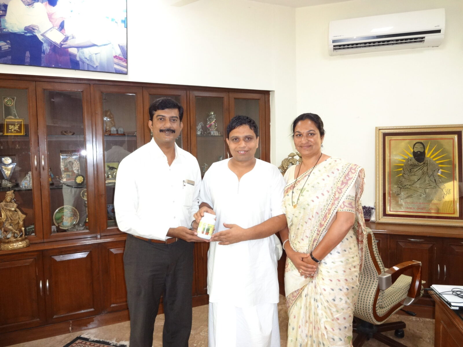 Mr. and Mrs. Hemant Girme with Acharya Balkrishna